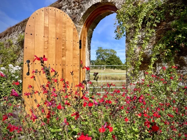 red flowers rustic garden gate 1